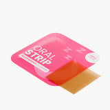 Pink packaging of an oral strip with a red strip inside on a white background. Dissolves easily on your tongue
